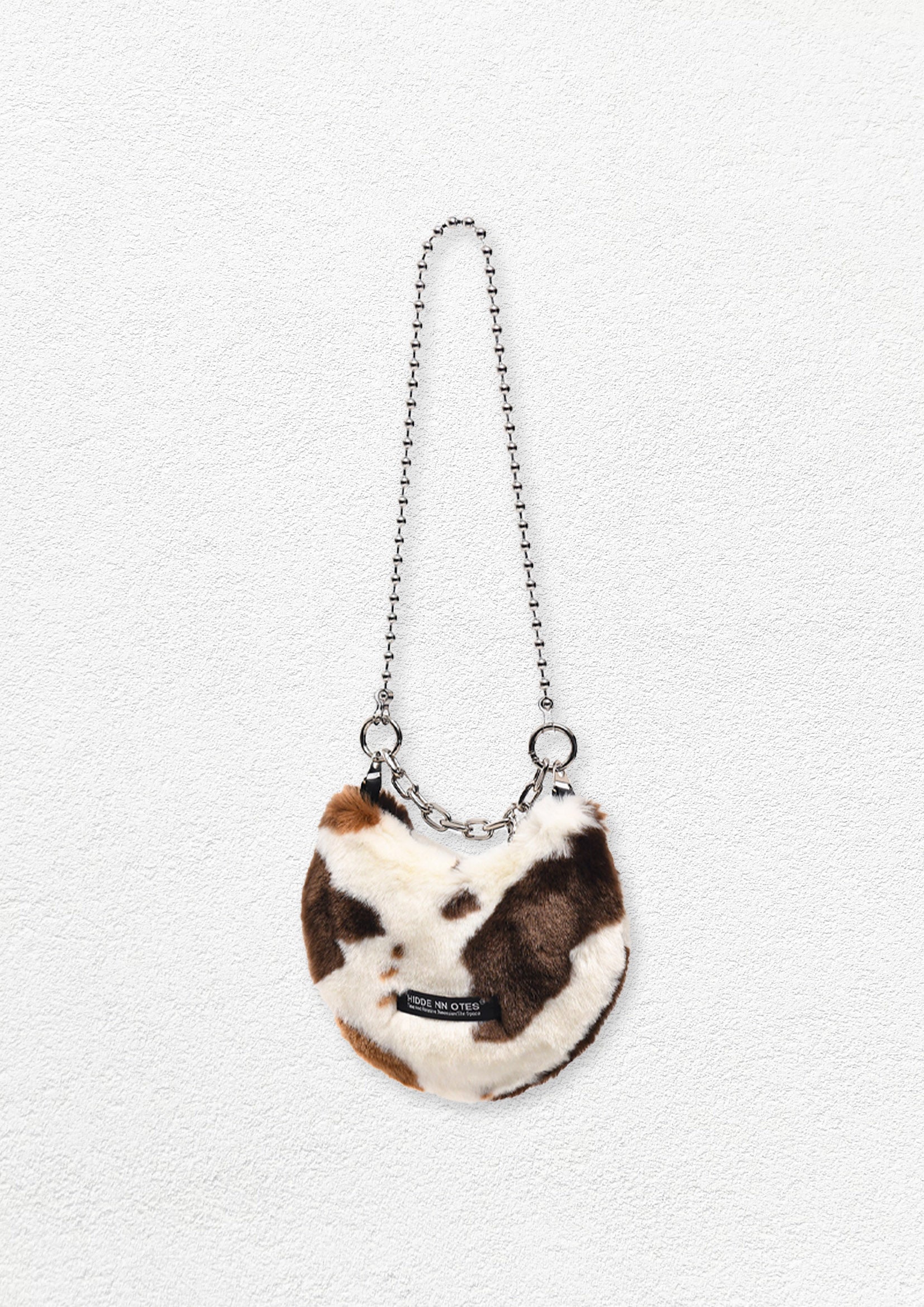 Fluffy shoulder/hand moon bag - cow