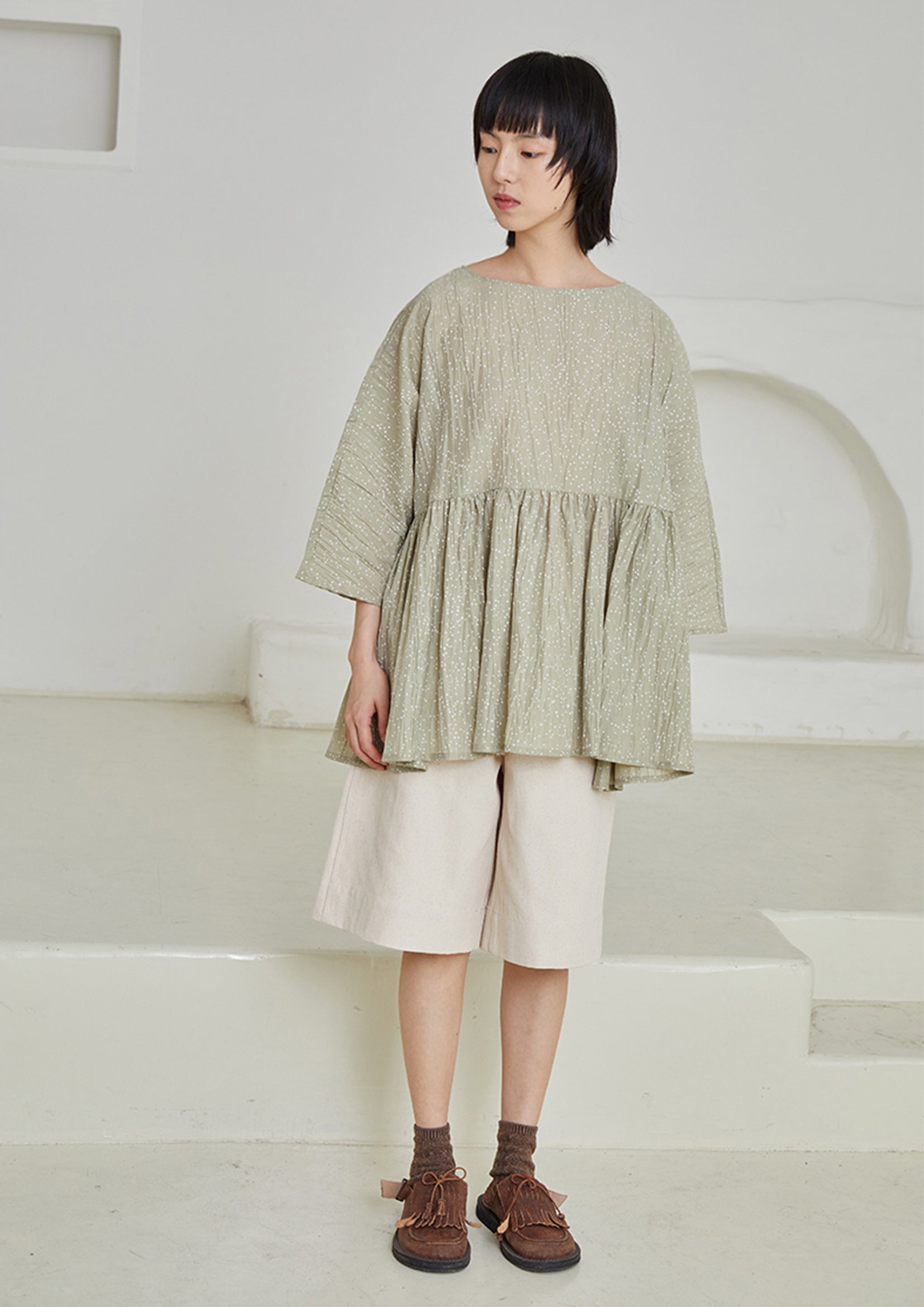 Dot textured loose smock top in pale green